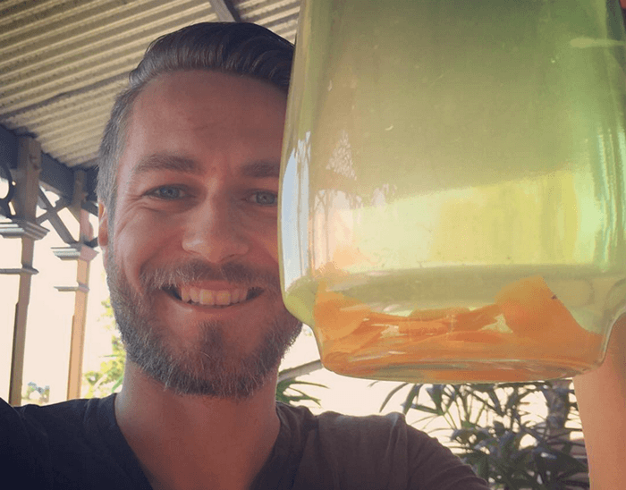 ross showing lemon water with turmeric slices